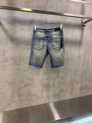 Blue AMIRI distressed denim shorts