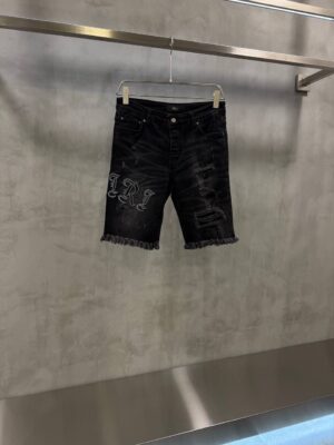 Black AMIRI distressed denim shorts