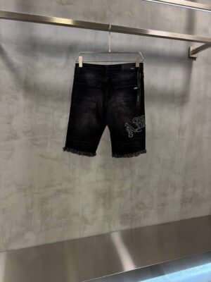 Black AMIRI distressed denim shorts