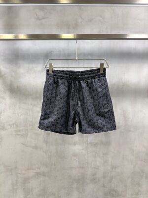 Black on black Off-White all-over stenciled monogram logo swim shorts