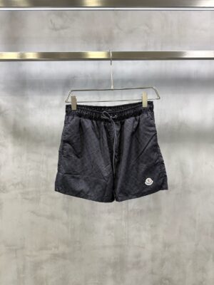 Black on black Moncler all-over M pattern monogram-jacquard swim shorts