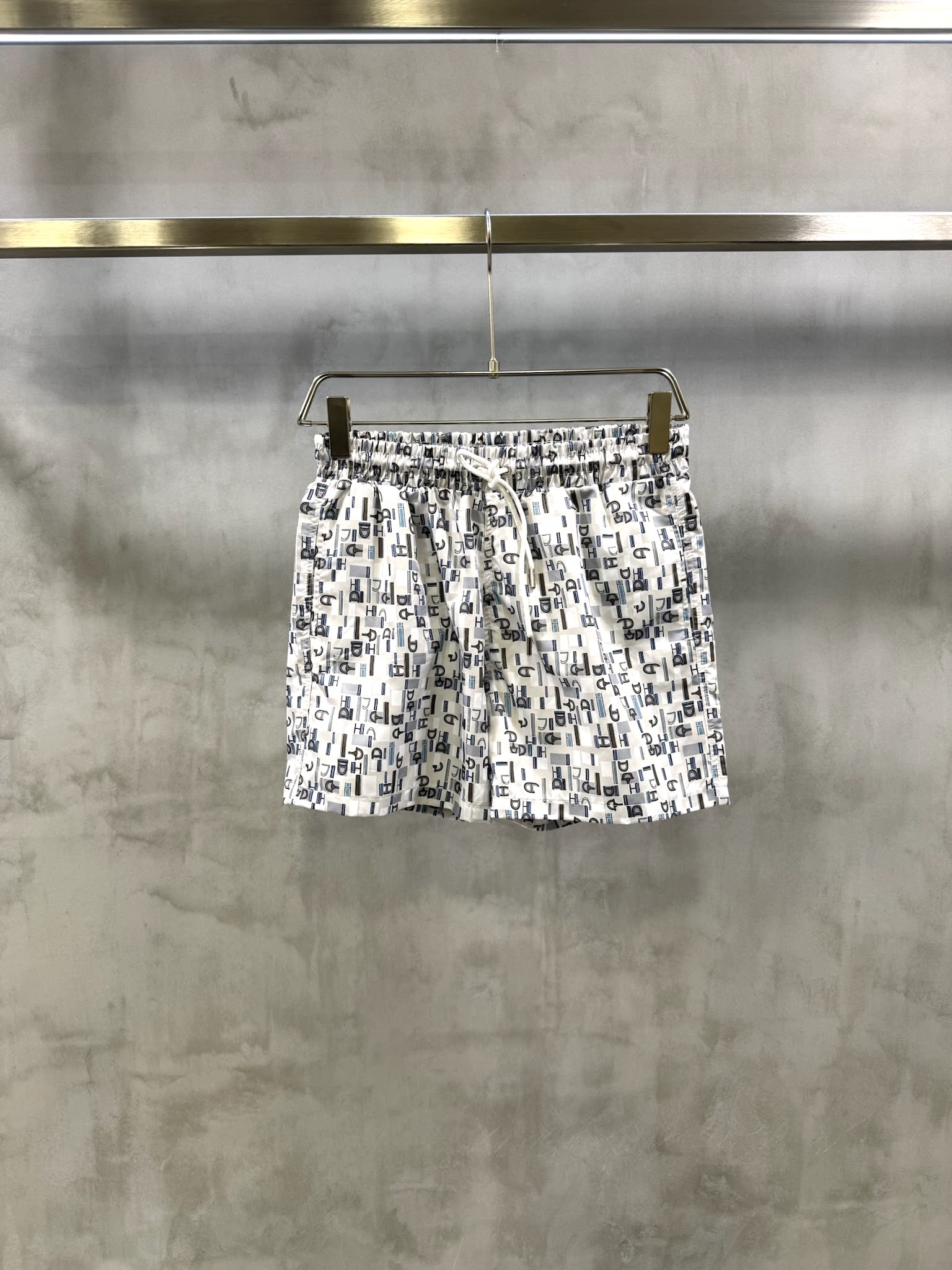 White Hermès Coups de Goua H all-over monogram Chaine d Ancre motif print swim trunks