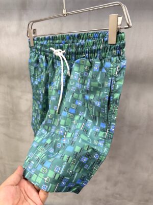 Green Hermès Metal au Carre swim trunks